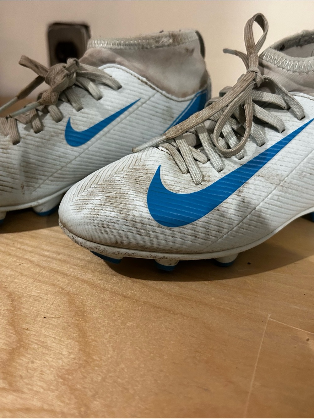 Nike Kids White Soccer Cleats with Blue Swoosh